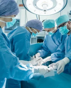 stock-photo-medical-team-performing-surgical-operation-in-bright-modern-operating-room-7414338551
